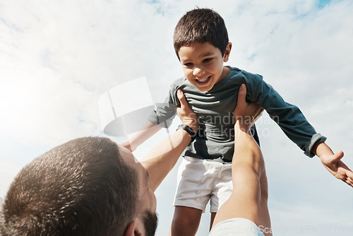 Image of Family, father and child in air outdoors enjoying playing on holiday, vacation and weekend in park. Freedom, childhood and happy face of boy with dad lifting son for bonding, quality time and relax