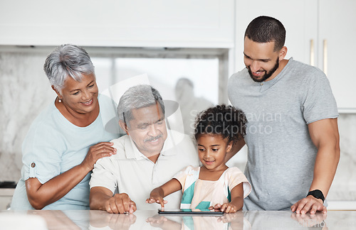 Image of Learning, big family and girl with tablet in home, playing online games or educational app. Bonding, touchscreen or care of happy grandparents and father teaching kid how to use technology in kitchen