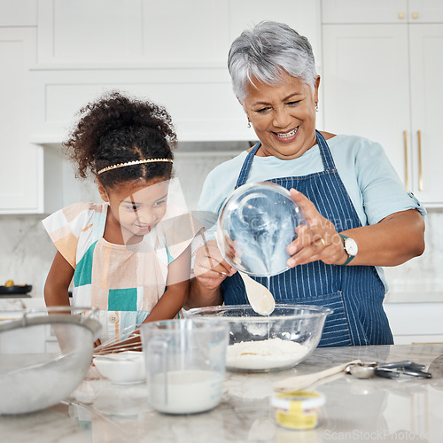 Image of Learning, cooking and grandmother with girl in kitchen mixing milk and flour in bowl. Education, family care and happy grandma teaching child how to bake, bonding and enjoying baking time together.