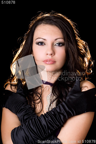 Image of Portrait of the young woman over black