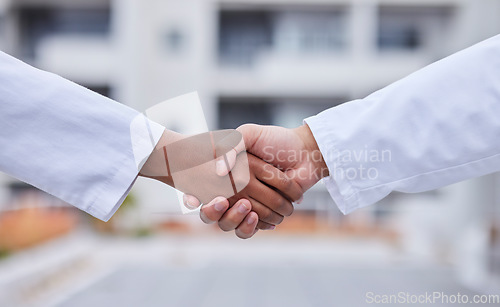 Image of Handshake, b2b meeting and doctors shaking hands for success collaboration, teamwork and medicine partnership. Thank you, welcome and medical support from startup company employee at hospital lobby