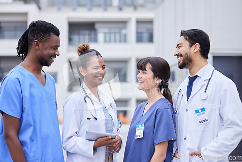 Image of Doctors, happy or team building with tablet outdoor for collaboration, networking or medicine search. Medicine, medical or group of nurse smile with 5g tech for idea research, innovation or analytics