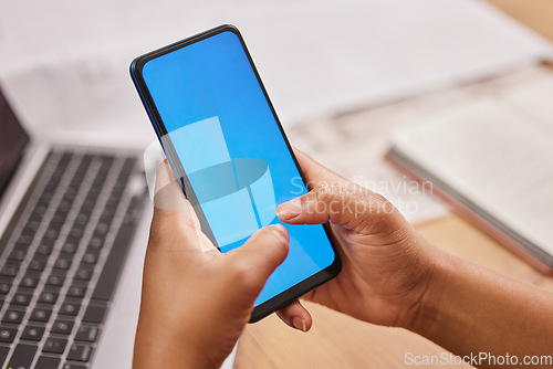 Image of Person, hands and phone typing on mockup for advertising, marketing or communication at the office desk. Hand of employee on mobile smartphone with blue screen display or chromakey for advertisement