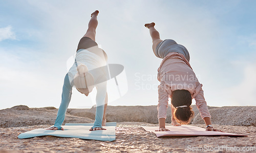 Image of Yoga, flare and woman friends on the beach together for mental health, wellness or fitness in summer. Exercise, diversity or nature with a female yogi and friend practicing meditation outside