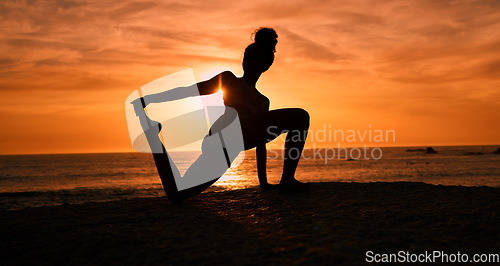 Image of Meditation, yoga and silhouette of woman on beach at sunrise for exercise, training and pilates workout. Motivation, fitness and shadow of girl balance by ocean for sports, wellness and stretching