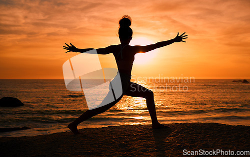 Image of Meditation, yoga and silhouette of woman on beach at sunrise for exercise, training and pilates workout. Morning, fitness and shadow of girl balance by ocean for sports, body wellness and stretching