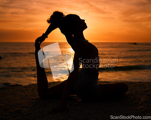 Image of Pilates, yoga and silhouette of woman on beach at sunrise for exercise, training and fitness workout. Motivation, meditation and shadow of girl balance by ocean for sports, wellness and stretching