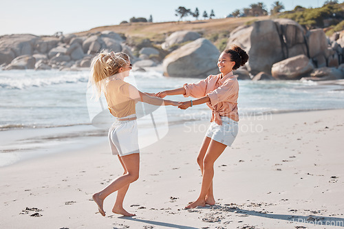 Image of Couple holding hands on beach, lesbian women have fun with travel and adventure outdoor, ocean and freedom to love. Interracial relationship, holiday in Australia and lgbtq, playful and care free