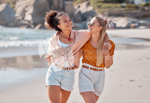 Image of Couple on beach, lesbian and happy with travel, gay women hug outdoor with adventure and freedom to love by ocean. Interracial relationship, holiday in Australia and lgbtq with commitment happiness