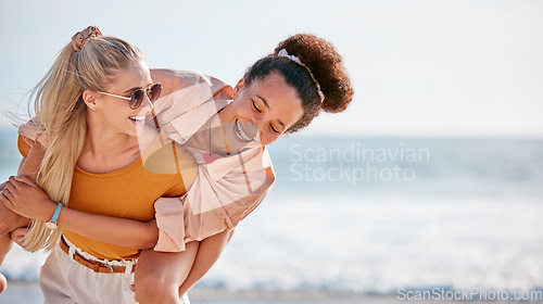 Image of Piggyback, friends and women at beach on holiday, vacation or summer trip outdoors. Travel, diversity and girls or females having fun, laughing at joke and enjoying time together by ocean or seashore