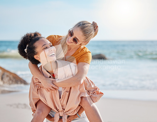 Image of Ocean, piggyback and happy couple of friends for lgbtq, lesbian or love and freedom on summer vacation together. Blue sky, beach and diversity women on date, fun support or excited valentines holiday