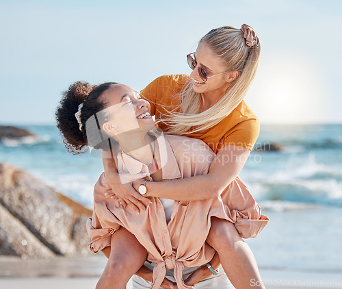 Image of Piggy back, happy or friends at the beach relaxing, talking or laughing on summer holiday vacation in Florida, USA. Bonding, smile or women enjoy traveling to sea or ocean on girls trips with freedom