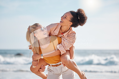 Image of Piggyback, happy or friends at a beach to relax talking or laughing on summer holiday vacation in Florida, USA. Bonding, smile or women enjoy traveling to sea or ocean on girls trips with freedom