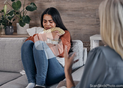 Image of Counseling, psychology woman and patient crying in therapy for mental health problem, depression or anxiety. Sad, depressed or trauma client, consulting professional therapist or psychologist on sofa