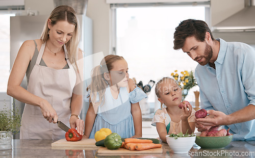 Image of Mom, dad and children cooking with vegetables ingredients for lunch, dinner or meal prep. Family, food and parents with girls learn, development and help in kitchen for nutrition, diet and wellness