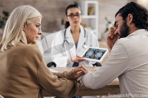 Image of Neurology, fear and doctor with mother and son, mri brain scan or x ray diagnosis for cancer. Consulting, man and woman in doctors office with stress, health problem, healthcare patient in hospital