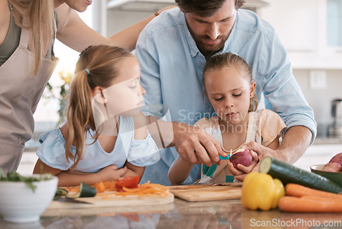 Image of Cooking, kitchen and parents with children with vegetables for healthy lunch, food nutrition or meal prep together. Family, chef skills and dad with girls learning, teaching and help cut ingredients