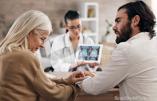 Image of Brain, scan and doctor with mother and son for mri results or xray diagnosis for cancer on tablet. Healthcare, advice and patient in doctors office consulting on health problem for hospital treatment