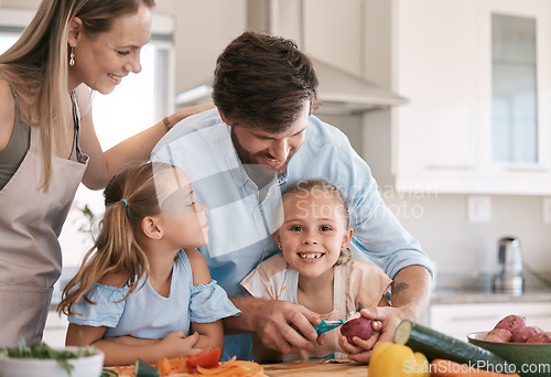 Image of Children and parents cooking in kitchen with vegetables for healthy lunch, organic food or meal prep. Family, smile and portrait of girl learning, develop chef skills and helping peel ingredients