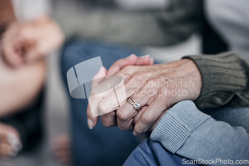 Image of Holding hands, praying or therapy with group, support and worship with mental health, faith and empathy for people in crisis. Psychology, trust and respect with community in counseling for trauma