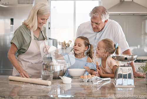 Image of Kitchen, baking and senior family with children bonding, love and learning in morning with breakfast support. Real people or grandparents and girl kids teaching, cooking and food for home development