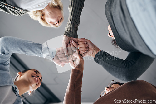 Image of People, hands and smile for fist bump below in trust, unity or collaboration together in solidarity. Hand of support group bumping fists in team agreement or coordination for community achievement