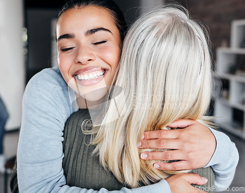 Image of Love, comfort and woman hugging her mother for support, peace or consoling in their family home. Happy, smile and young lady embracing her mature mom with care, happiness and affection at their house