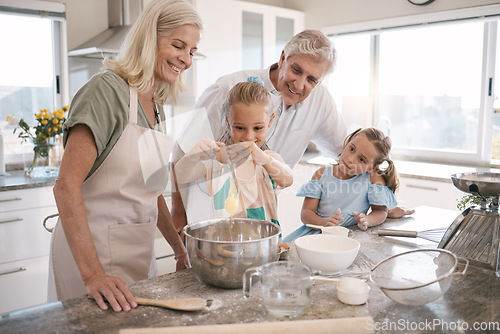 Image of Family, bonding or baking children and eggs, flour or wheat in kitchen, house or home of pastry, dessert cake or food. Happy, grandparents or cooking kids learning a bakery pudding or cookies recipe