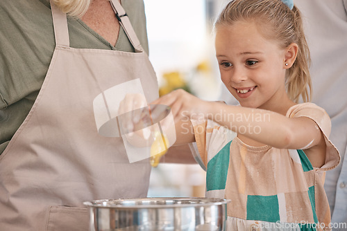 Image of Child, girl and baking with eggs, grandparent or senior woman in kitchen, bonding house or family home for pastry, dessert cake or food. Happy smile, cooking and kid learning a bakery cookies recipe