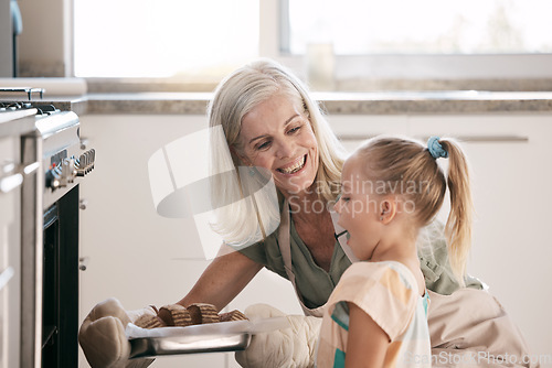 Image of Wow child, girl or oven baking grandparent, senior or elderly woman in kitchen, bonding house or family home. Happy surprised or amazed cooking kid with grandmother in dessert, cake or food learning