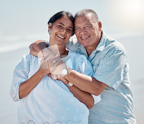 Image of Retirement couple, portrait and hug at beach for love, care and relax on summer holiday, vacation or date. Happy senior man, woman and embrace at sea for happiness, support and smile in calm sunshine