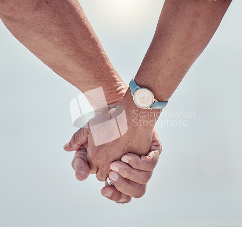 Image of Couple holding hands with love on outdoor background for care, relationship or marriage support. Closeup hand of man, woman and people walking in nature, holiday and relax together on date of partner