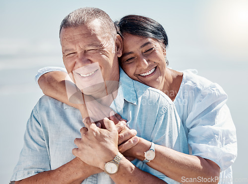 Image of Senior couple, beach and hug of love, relax and trust on summer holiday, vacation or date. Happy retirement, man and woman embrace at ocean for happiness, support and smile outdoor in calm sunshine