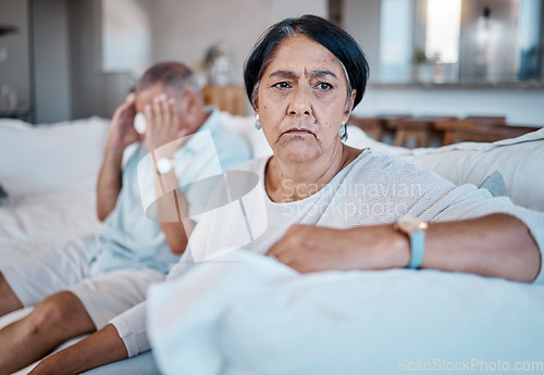 Image of Divorce, problem and senior couple on sofa with sadness, depression and frustrated from conflict argument. Marriage mistake, fight and woman with angry man unhappy, upset and thinking of breakup