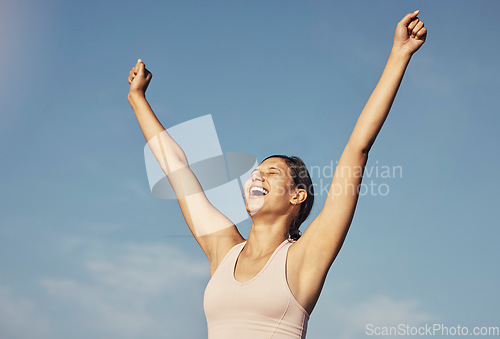 Image of Fitness success, workout and woman arms in air for workout achievement outdoor. Excited, smile and athlete with blue sky feeling freedom from motivation and happiness with exercise target goal