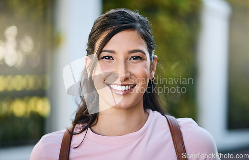 Image of Woman, travel and portrait of a young person from Japan with a smile and blurred background. Backpack, happiness and freedom of a female in summer on a urban adventure for traveling on vacation