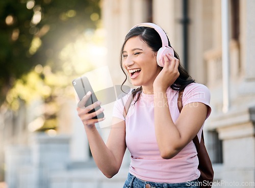 Image of Music, headphones or video call by woman in city for travel, happy and smile on building background. Radio, podcast and travelling girl student with app, online audio or subscription service outside