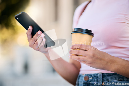 Image of Woman, phone and hands with coffee of a young person checking gps mobile data for travel. Networking, online communication and text of a traveler on cellphone with blurred background on web app