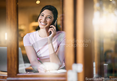 Image of Coffee shop window, portrait and woman on a phone call doing online work in a cafe. Computer, smile and happiness of a young person in a restaurant doing online writing in the morning with lens flare