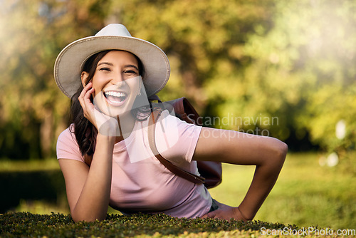 Image of Woman, portrait and park activity of a young person happy about nature, travel and freedom. Happiness, smile and laughing female with blurred background in a garden feeling relax and summer fun