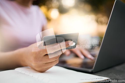 Image of Credit card, woman hands and finance data of a female checking savings, budget and bills. Financial payment, ecommerce and computer accounting info of a young person with a notebook for planning