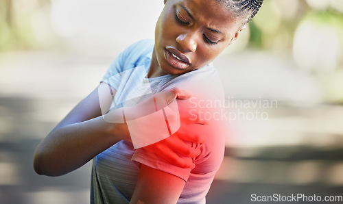 Image of Fitness, nature and woman with shoulder pain, injury or accident while running in a park. Sports, workout and African female athlete with a medical emergency or sprain muscle after a cardio exercise.