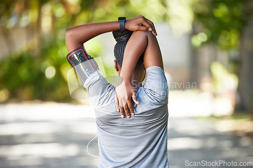 Image of Black woman, fitness and stretching arms for running, cardio exercise or workout preparation in nature. African American female in warm up arm stretch behind back getting ready for run or training