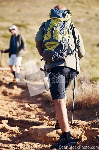 Image of Senior hiking, nature and elderly men walking on a mountain path outdoor for cardio. Friends, exercise and workout in summer of an old man back on a journey and adventure in the mountains for fitness