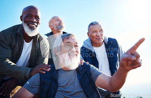 Image of Senior hiking, blue sky and nature walk of elderly men together in retirement pointing. Friends, trekking adventure and happiness of old people outdoor for health, wellness and fitness on a journey