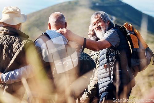 Image of Senior hiking, mountain and elderly friends in nature on a walk with freedom and hug in retirement. Healthy exercise, trekking and and outdoor travel adventure of old men group together for walk