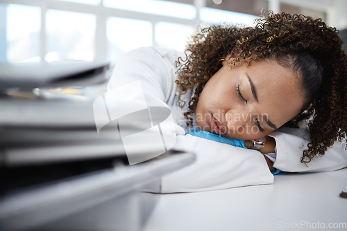 Image of Science, tired and scientist sleeping in lab after working on innovation experiment, test or research. Exhausted, burnout and professional female scientific employee taking nap on desk in laboratory.