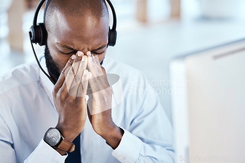 Image of Call center, headache and black man with stress and anxiety from telemarketing job in office. Online consultant, business man and contact us employee with burnout from customer service and allergies