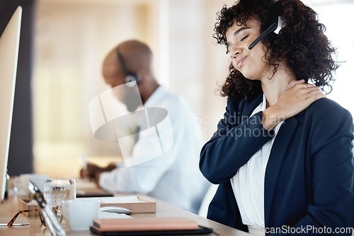 Image of Business, black woman and neck pain in call center, burnout and telemarketing for customer service. Corporate, female agent and consultant with muscle tension, fatigue and strain in modern office