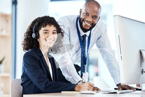 Image of Call center, customer service and portrait of a manager with a consultant helping with a consultation online. Happy, smile and professional telemarketing agents working on crm strategy in the office.